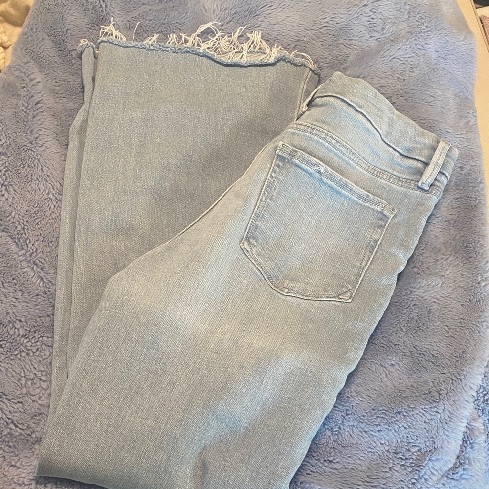 Good American raw hem flare jeans